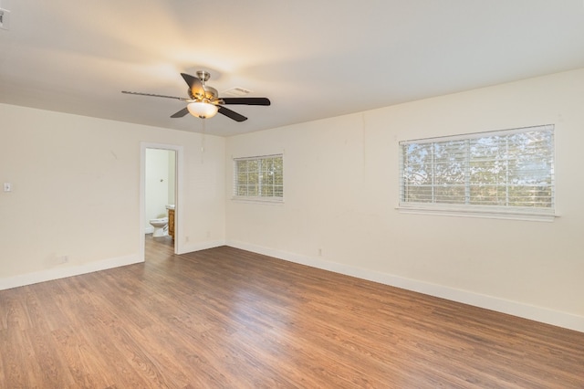 spare room with wood-type flooring and ceiling fan