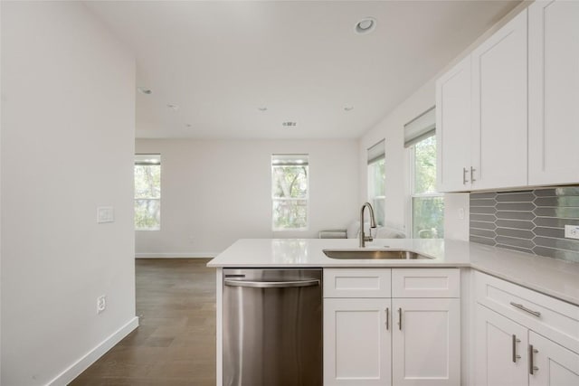 909 Capitol Ct Unit 2, Austin, TX 78756 - kitchen with dishwasher, a peninsula, white cabinets, light countertops, and recessed lighting