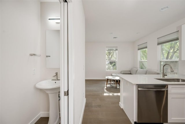 909 Capitol Ct Unit 2, Austin, TX 78756 - kitchen with dishwasher, white cabinets, dark wood-type flooring, open floor plan, and light countertops