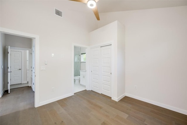 909 Capitol Ct Unit 2, Austin, TX 78756 - unfurnished bedroom with wood finished floors, a closet, and a ceiling fan