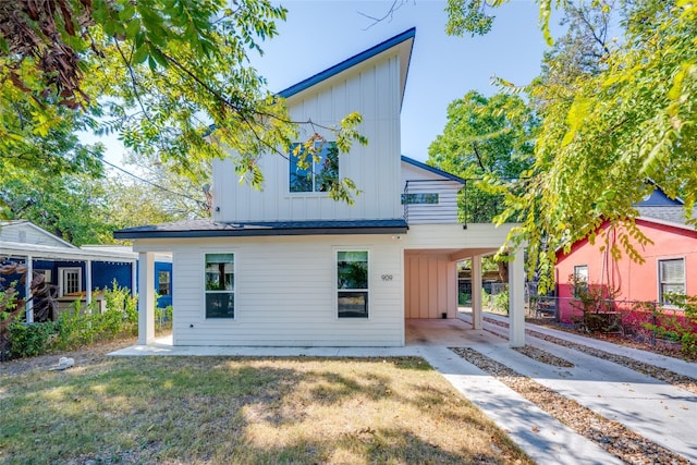 exterior space with a yard and a carport