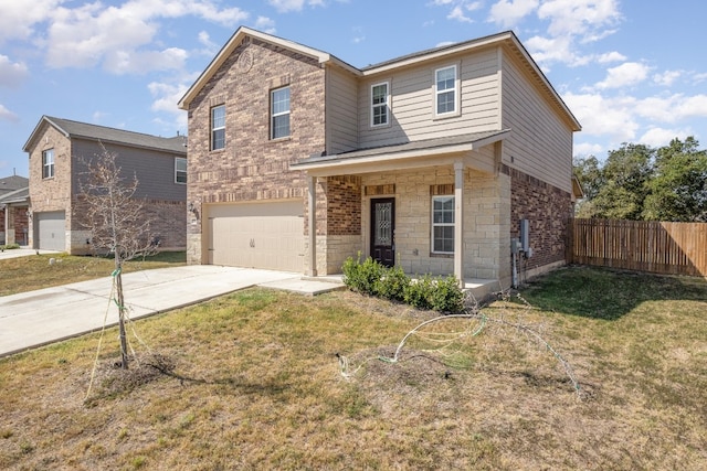 view of front of property featuring a garage and a front lawn