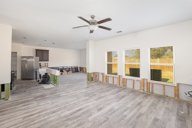 spare room featuring light hardwood / wood-style floors and ceiling fan