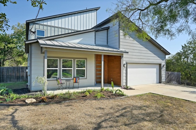 view of front of home with a garage and covered porch