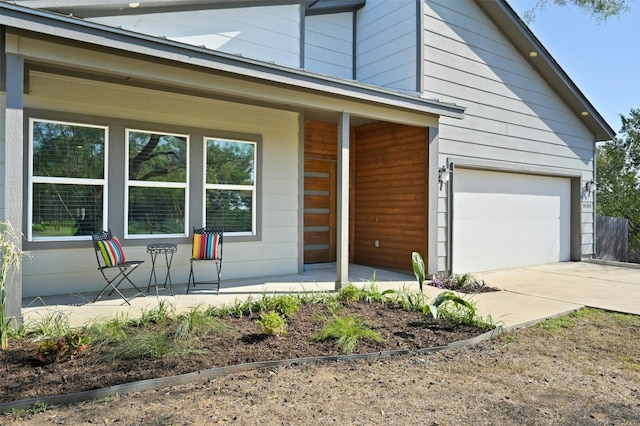 view of front of house featuring a garage and covered porch