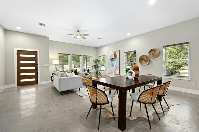 dining room featuring concrete floors and ceiling fan