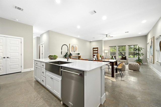 kitchen with sink, white cabinetry, concrete floors, dishwasher, and an island with sink