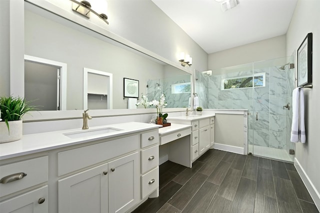 bathroom featuring vanity and an enclosed shower