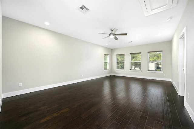 empty room featuring dark hardwood / wood-style flooring and ceiling fan