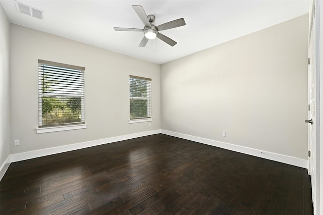 unfurnished room with dark wood-type flooring and ceiling fan