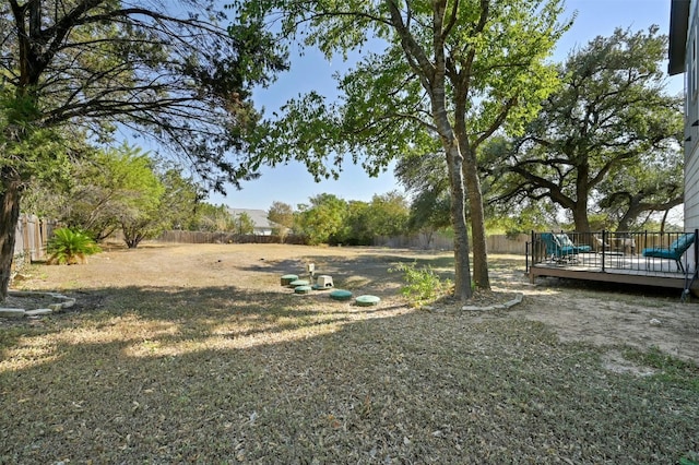 view of yard with a wooden deck