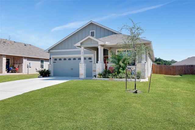 craftsman-style home featuring a garage and a front lawn