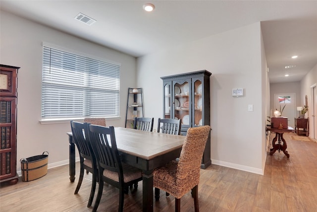 dining room with light hardwood / wood-style flooring