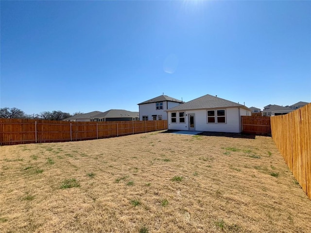 239 Hidalgo Ln, Elgin, TX 78621 - rear view of property with a patio area