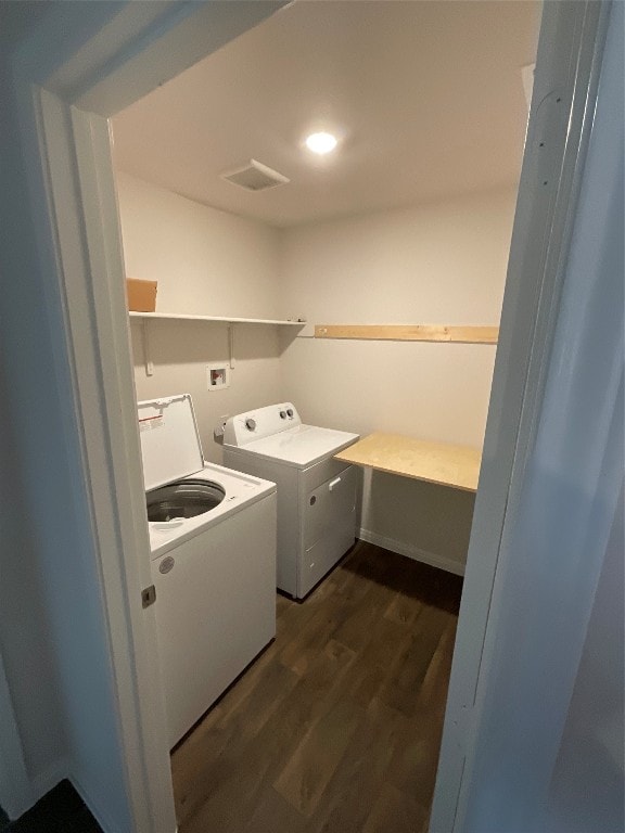 laundry room featuring dark wood-type flooring and independent washer and dryer