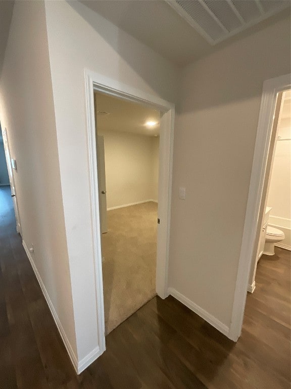 hallway featuring dark wood-type flooring