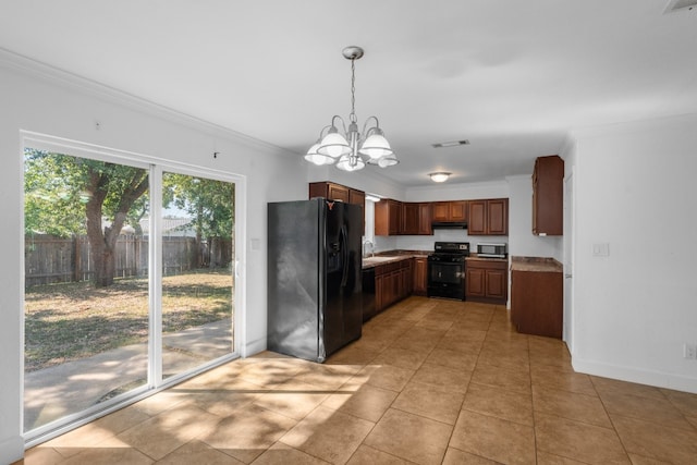 kitchen featuring black appliances, sink, pendant lighting, crown molding, and a notable chandelier