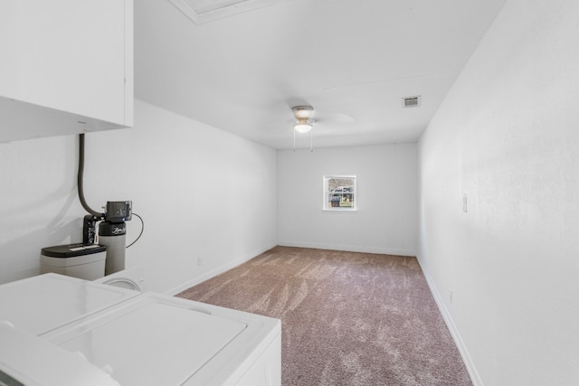 clothes washing area with cabinets, carpet floors, and ceiling fan