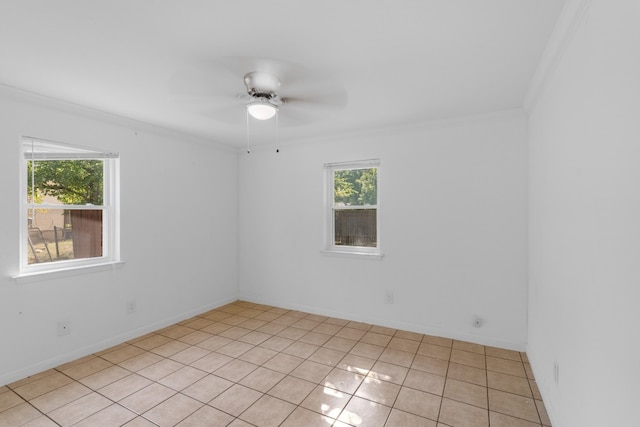 tiled empty room featuring crown molding, a healthy amount of sunlight, and ceiling fan