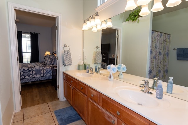 bathroom with tile patterned flooring and vanity