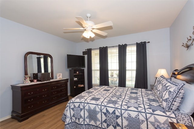 bedroom featuring ceiling fan and light hardwood / wood-style floors