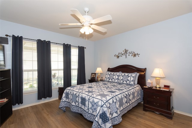 bedroom with hardwood / wood-style flooring and ceiling fan