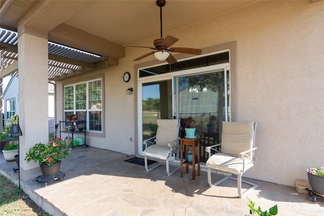 view of patio with a pergola and ceiling fan