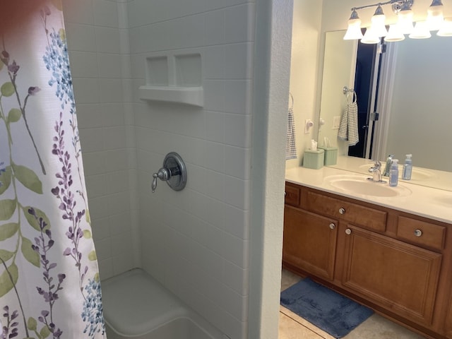 bathroom featuring tile patterned floors, a shower with curtain, and vanity