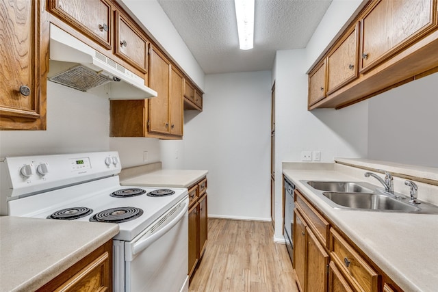 kitchen with light wood-type flooring, white electric stove, sink, stainless steel dishwasher, and a textured ceiling