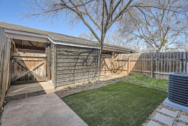 109 W Mockingbird Ln Unit A2, Austin, TX 78745 - view of yard with central AC unit and an outdoor structure