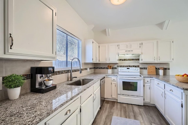 109 W Mockingbird Ln Unit A2, Austin, TX 78745 - kitchen with white range with electric stovetop, a sink, white cabinetry, and decorative backsplash