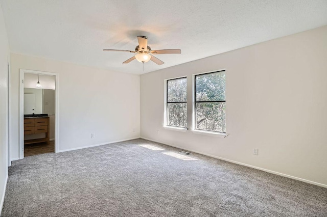 109 W Mockingbird Ln Unit A2, Austin, TX 78745 - carpeted spare room with a ceiling fan and baseboards