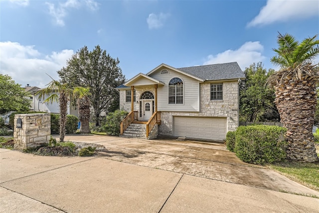 raised ranch featuring a garage