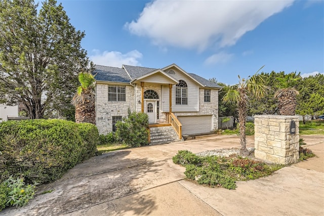 bi-level home featuring a garage