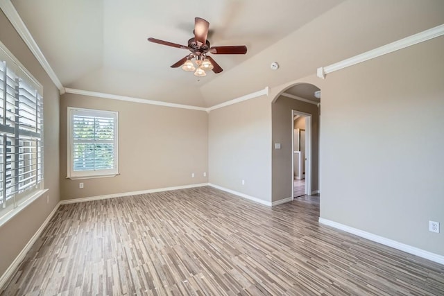 unfurnished room featuring ceiling fan, hardwood / wood-style flooring, crown molding, and lofted ceiling