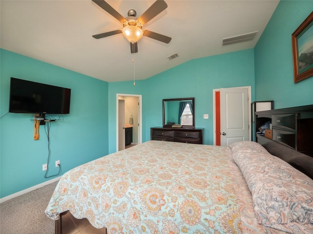 carpeted bedroom featuring ceiling fan and vaulted ceiling