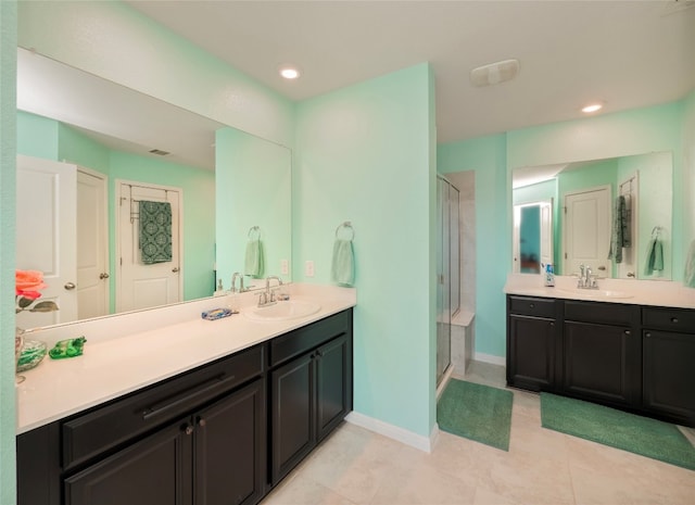 bathroom featuring vanity, tile patterned flooring, and an enclosed shower