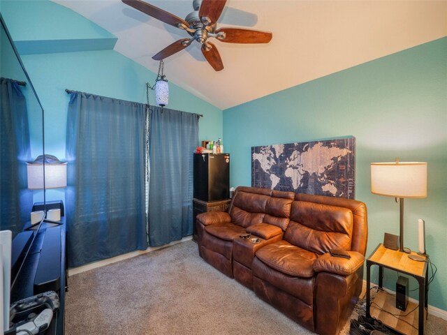 living room featuring lofted ceiling, carpet, and ceiling fan