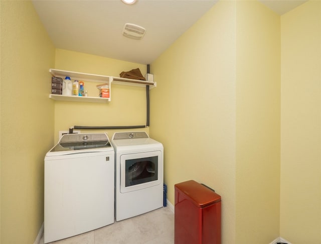 clothes washing area featuring washing machine and clothes dryer