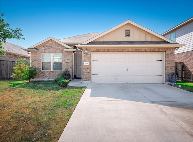 view of front of property with a garage and a front lawn