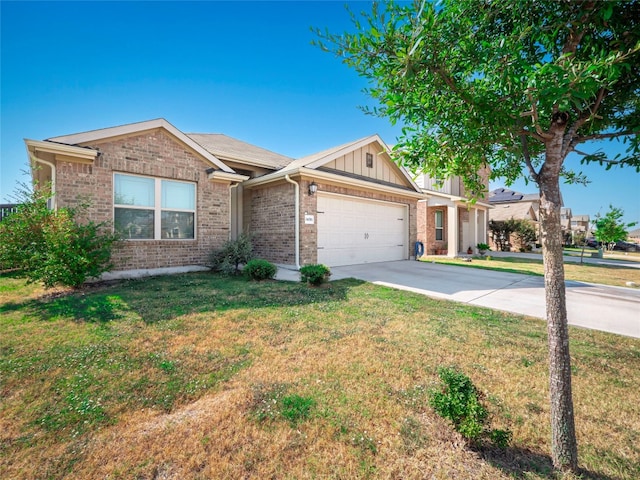 view of front of home featuring a garage and a front lawn