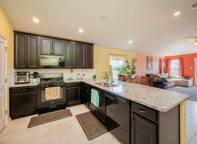 kitchen featuring light tile patterned flooring, sink, kitchen peninsula, and black appliances