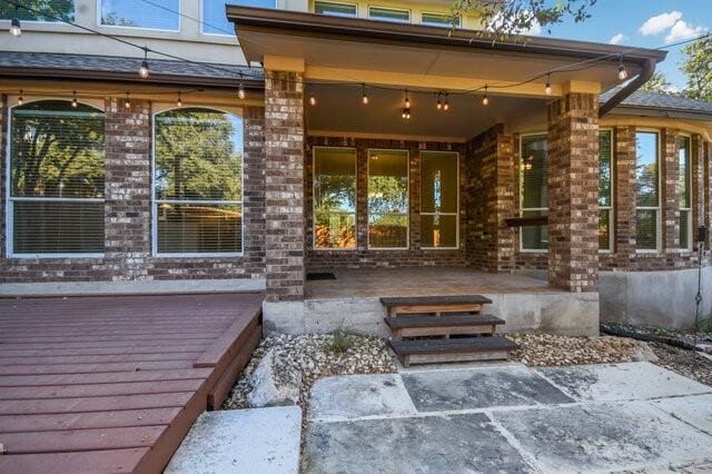 property entrance featuring a patio