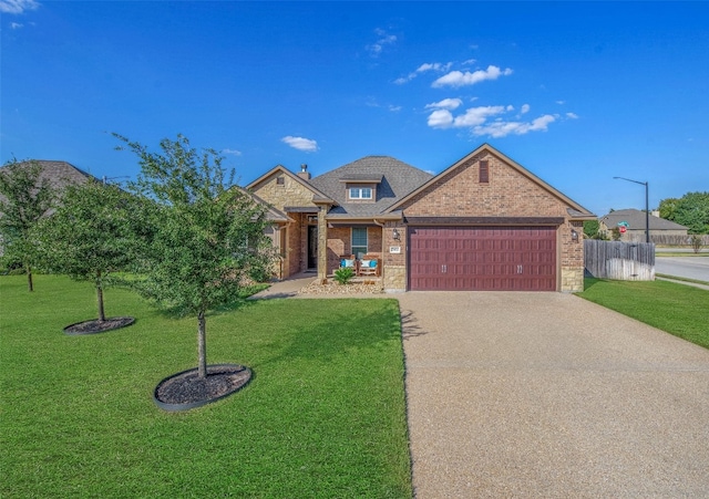 view of front facade with a front lawn and a garage