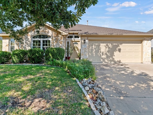 ranch-style house with a garage and a front lawn