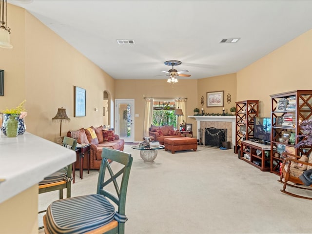 living room featuring light colored carpet and ceiling fan