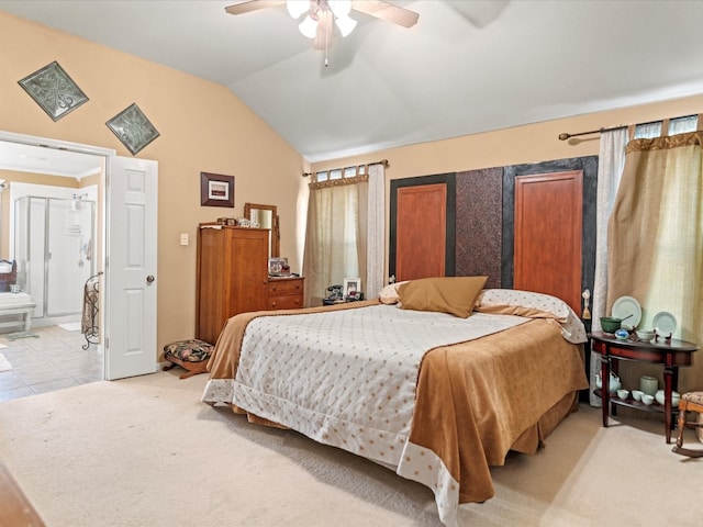 carpeted bedroom with connected bathroom, ceiling fan, and lofted ceiling