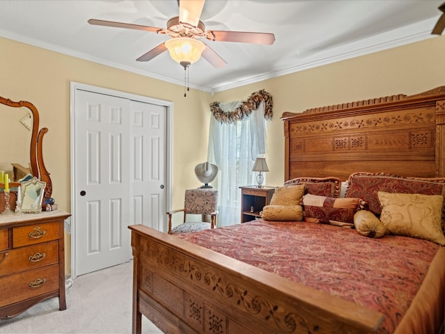 bedroom with crown molding, light colored carpet, a closet, and ceiling fan