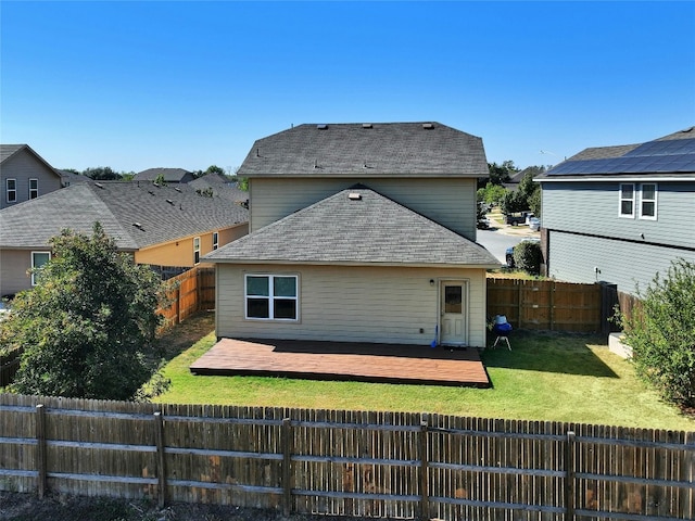 rear view of house featuring a patio and a lawn