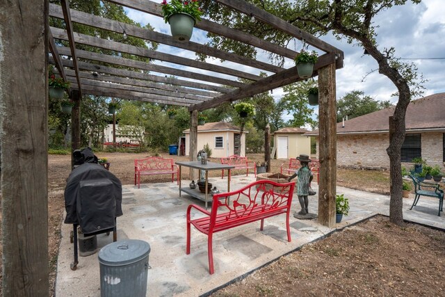 view of patio / terrace with a pergola, a storage shed, and a grill